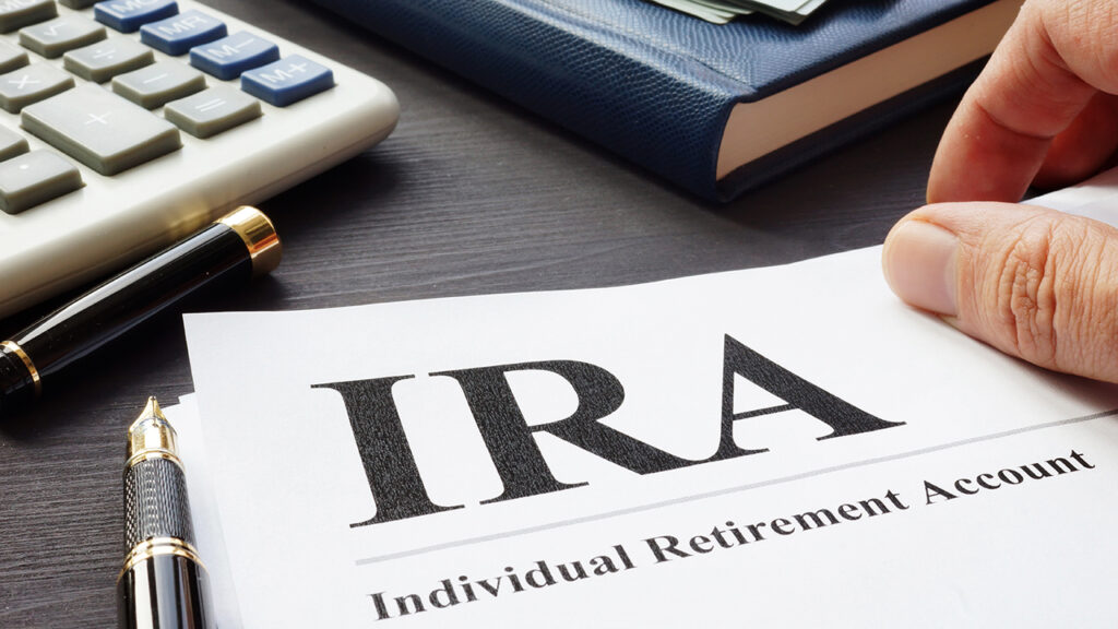 Documents about Individual retirement account IRA on a desk.