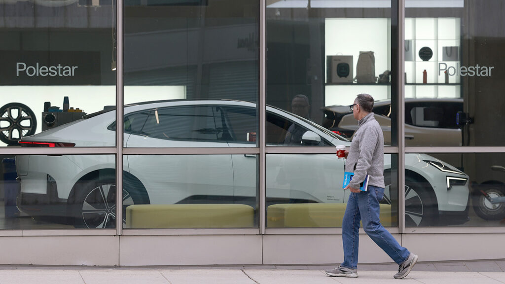 BEVERLY HILLS, CALIFORNIA – JUNE 26: A pedestrian walks by a Polestar dealership on June 26, 2026 in Beverly Hills, California. Electric car maker