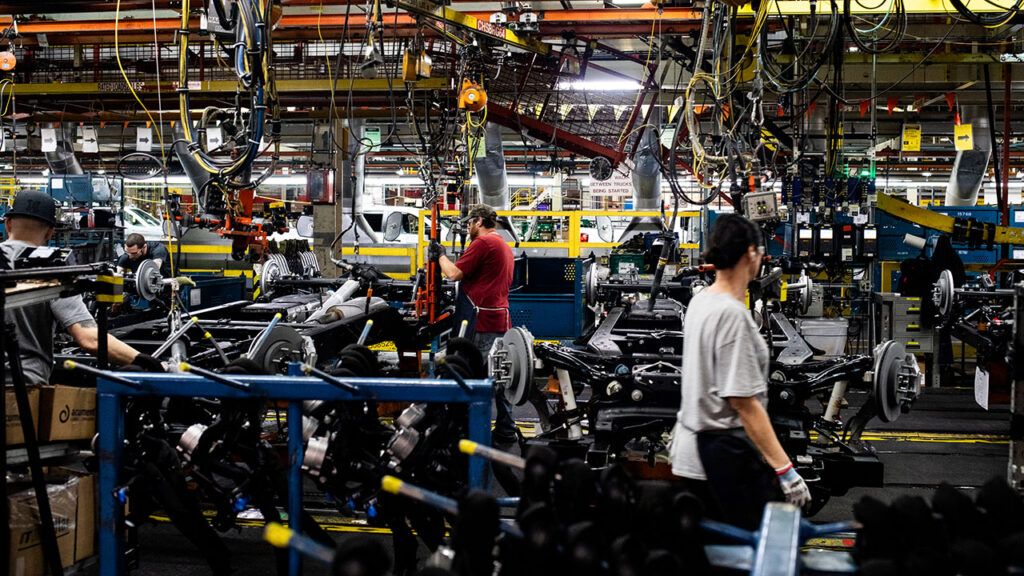 Workers assemble chassis parts for vehicle frames at the General Motors assembly plant in Fort Wayne, Indiana, US, on Tuesday, April 9, 2024. General